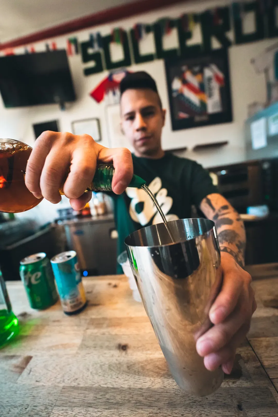 A bartender prepares a cocktail