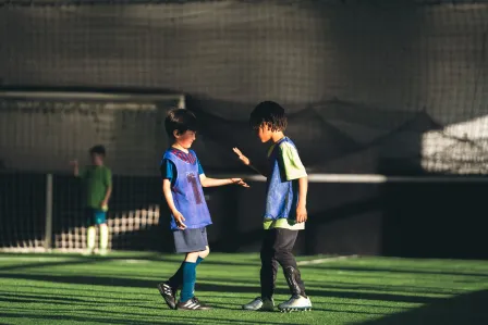 Two children making peace